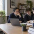 Students reviewing a university study plan with an academic advisor.